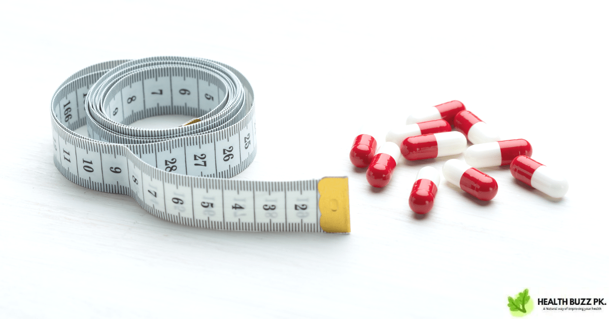 How Fast is Weight Loss on Wellbutrin? Red and white weight loss pills with white background and next to measuring tape