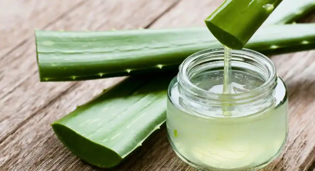 Aloe Vera leaf and aloe Vera gel on wooden table